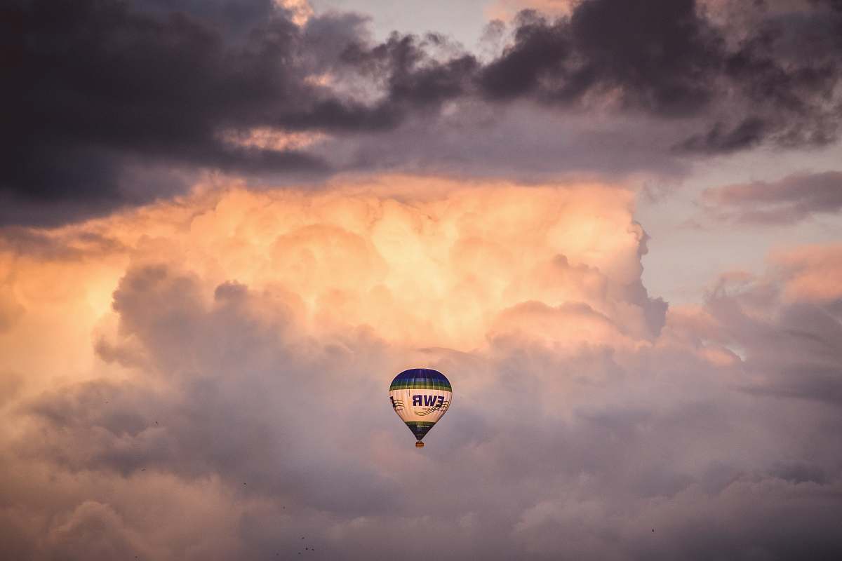 hot air balloon hot air balloon under the clouds weather